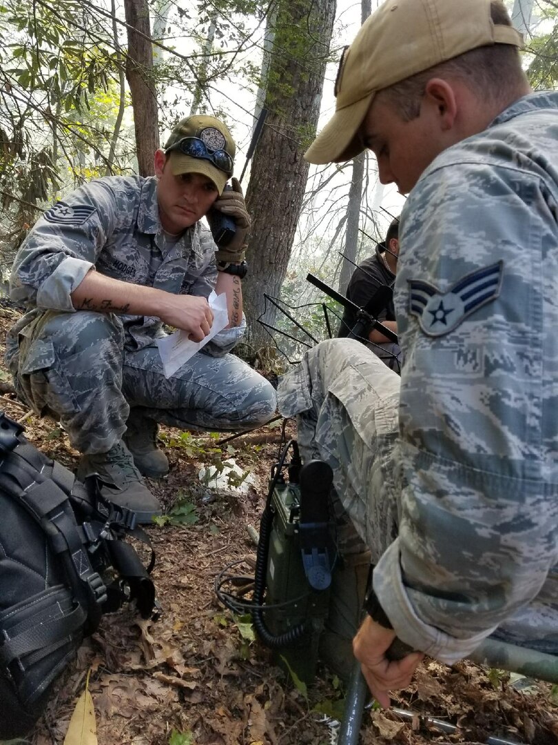 Members of the Hammer Adaptive Communications Element (ACE), 51st Combat Communications Squadron, 5th Combat Communication Group, participate in search and recovery efforts in response to a downed U.S. Navy aircraft incident Sept. 29 outside Tellico Plains, Tennessee. The efforts, which are currently ongoing in the Cherokee National Forest area, support both the recovery teams and the search for aircraft pieces needed by the Navy Aircraft Safety Investigation Board for the ongoing crash investigation. (courtesy photo)