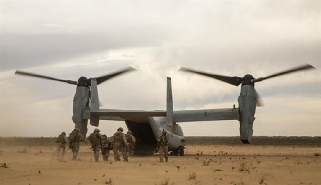 U.S. Marines with Charlie Company, 1st Battalion 7th Marine Regiment, Special Purpose Marine Air-Ground Task Force-Crisis Response-Central Command, recover a simulated casualty as part of a Tactical Recovery of Aircraft and Personnel exercise at an Undisclosed Location in Southwest Asia Jan. 12, 2016. SPMAGTF-CR-CC is ready to respond to any crisis response mission in theater to include the employment of a TRAP force.