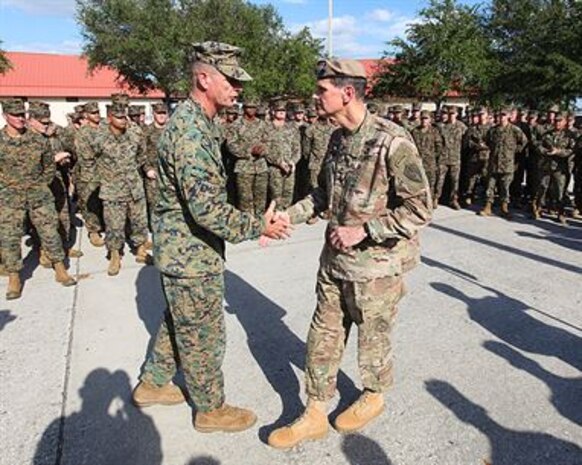 U.S. Army General Joseph L. Votel, commander of U.S. Central Command met with Lieutenant General William D. Beydler, Commander U.S. Marine Corps Forces, Central Command, at MacDill Airforce Base on November 8. General Votel visited the MARCENT Headquarters for a staff brief and tour of the facility. Additionally he recognized six MARCENT Marines for superior performance in their duties and provided them each one of his 4-star challenge coins.