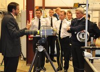 IMAGE: DAHLGREN, Va. (Oct. 2, 2017) - British Royal Navy First Sea Lord Adm. Sir Philip Jones is briefed on U.S. Navy high energy laser programs by Dr. Chris Lloyd, High Energy Laser Lethality lead at Naval Surface Warfare Center Dahlgren Division (NSWCDD). Lloyd explained the importance of rigorous modeling and laboratory testing against target materials to ensure high energy laser systems are built that meet the requirements of the warfighter once fielded. More than 18 NSWCDD subject matter experts briefed Jones and his delegation on programs that included HSI, gun systems, ballistic missile fire control, directed energy, and electric weapons such as the Laser Weapon System.