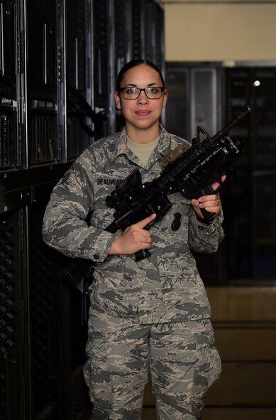 U.S. Air Force Senior Airman Jasmine Deauvearo, an armorer assigned to the 509th Security Forces Squadron (SFS), holds an M4 carbine with an M320A1 grenade launcher attached at Whiteman Air Force Base, Mo., April 24, 2017.