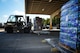 Staff Sgt. Kens Germain, an aerial porter from Joint Base McGuire-Dix-Lakehurst, New Jersey, positions a forklift to set down a stack of ready-to-eat meals at Dobbins Air Reserve Base, Ga., Oct. 4. A total of 23,390 pounds of food and water will be transported to Puerto Rico and distributed to those in need. (U.S. Air Force photo by Tech. Sgt. Kelly Goonan)