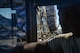 Staff Sgt. Kens Germain, an aerial porter from Joint Base McGuire-Dix-Lakehurst, New Jersey, watches as three pallets of water and meals ready-to-eat are loaded onto a K-loader at Dobbins Air Reserve Base, Ga. Oct. 4. A total of 23,390 pounds of food and water will be transported to Puerto Rico and distributed to those in need. (U.S. Air Force photo by Tech. Sgt. Kelly Goonan)