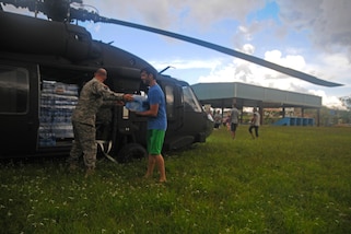 New York National Guardsmen, along with the Puerto Rico National Guard, brought water to a community affected by Hurricane Maria at Lares, Puerto Rico, Oct. 4, 2017. Puerto Rico National Guard photos by Spc. Agustín Montañez