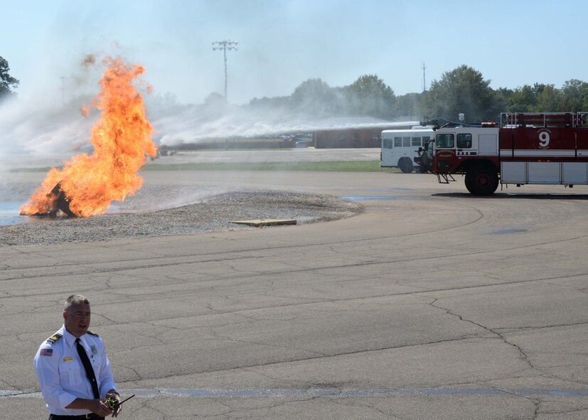 William O’Meara, Assistant Chief of Health and Safety for fire and emergency services, narrates a simulated aircraft crash Sept. 30, 2017, on Columbus Air Force Base, Mississippi. A P-19 Stryker firetruck was used to extinguish the burning wreckage. The P-19 holds 1,500 gallons of water, 500 gallons of foam and has a top speed of 72 miles per hour. (U.S. Air Force photo by Airman 1st Class Beaux Hebert)