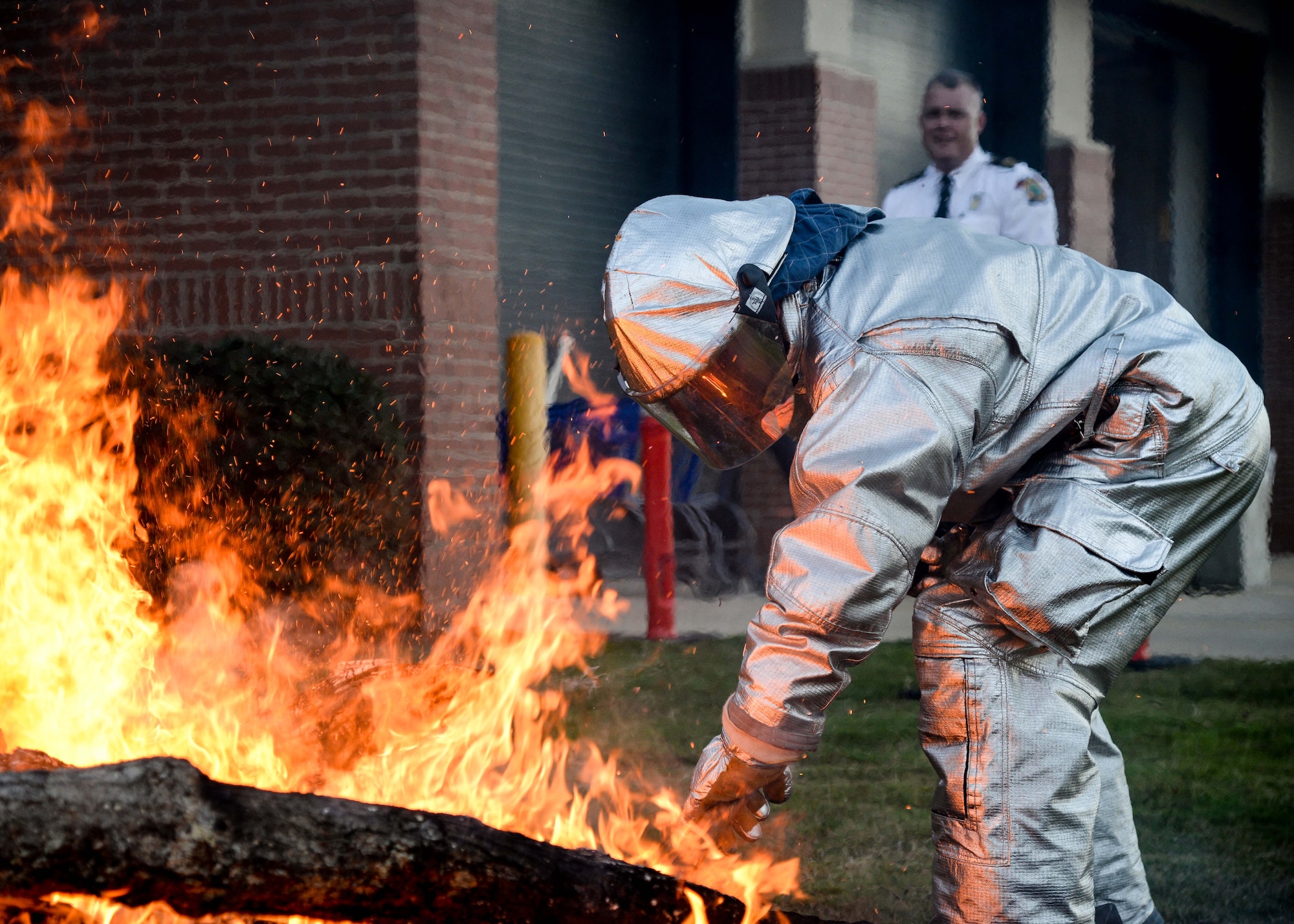 Airman Michael Cargile, 14th Civil Engineer Squadron firefighter, uses a shovel to take coals from a fire and place them in a barbeque pit Sept. 29, 2017, on Columbus Air Force Base, Mississippi. The Columbus AFB Fire Department hosted a s’mores roast and played an informational video for families during Fire Prevention Week Sept. 25-30. (U.S. Air Force photo by Airman 1st Class Beaux Hebert)