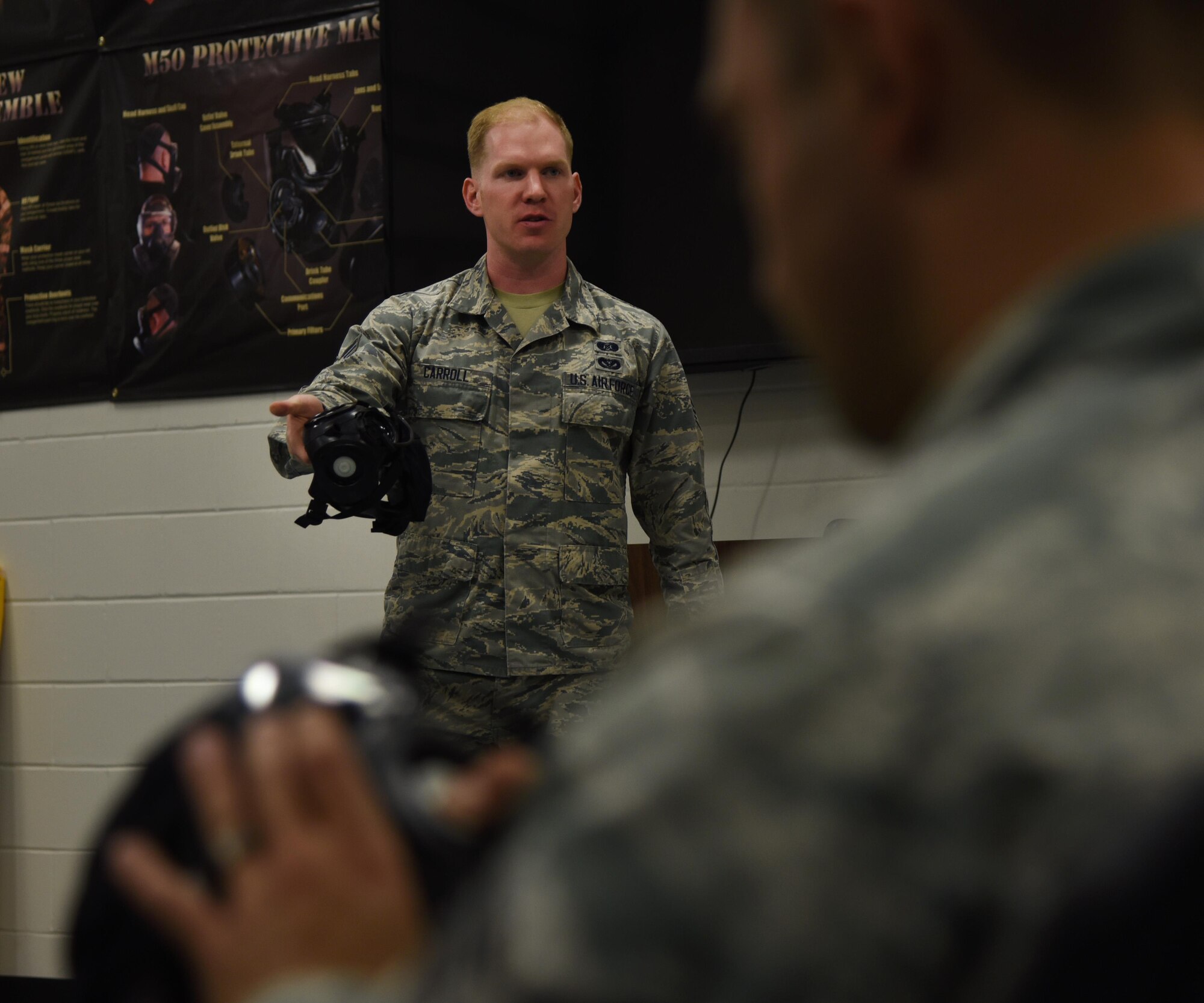 Senior Airman Max Carroll, 22nd Civil Engineer Squadron emergency management training and logistics NCO in charge, facilitates Chemical, Biological, Radiological and Nuclear Survival Skills Training Oct. 3, 2017, at McConnell Air Force Base, Kansas. Airmen are now required to attend CBRN SST every 18 months to sustain basic deployment readiness standards.