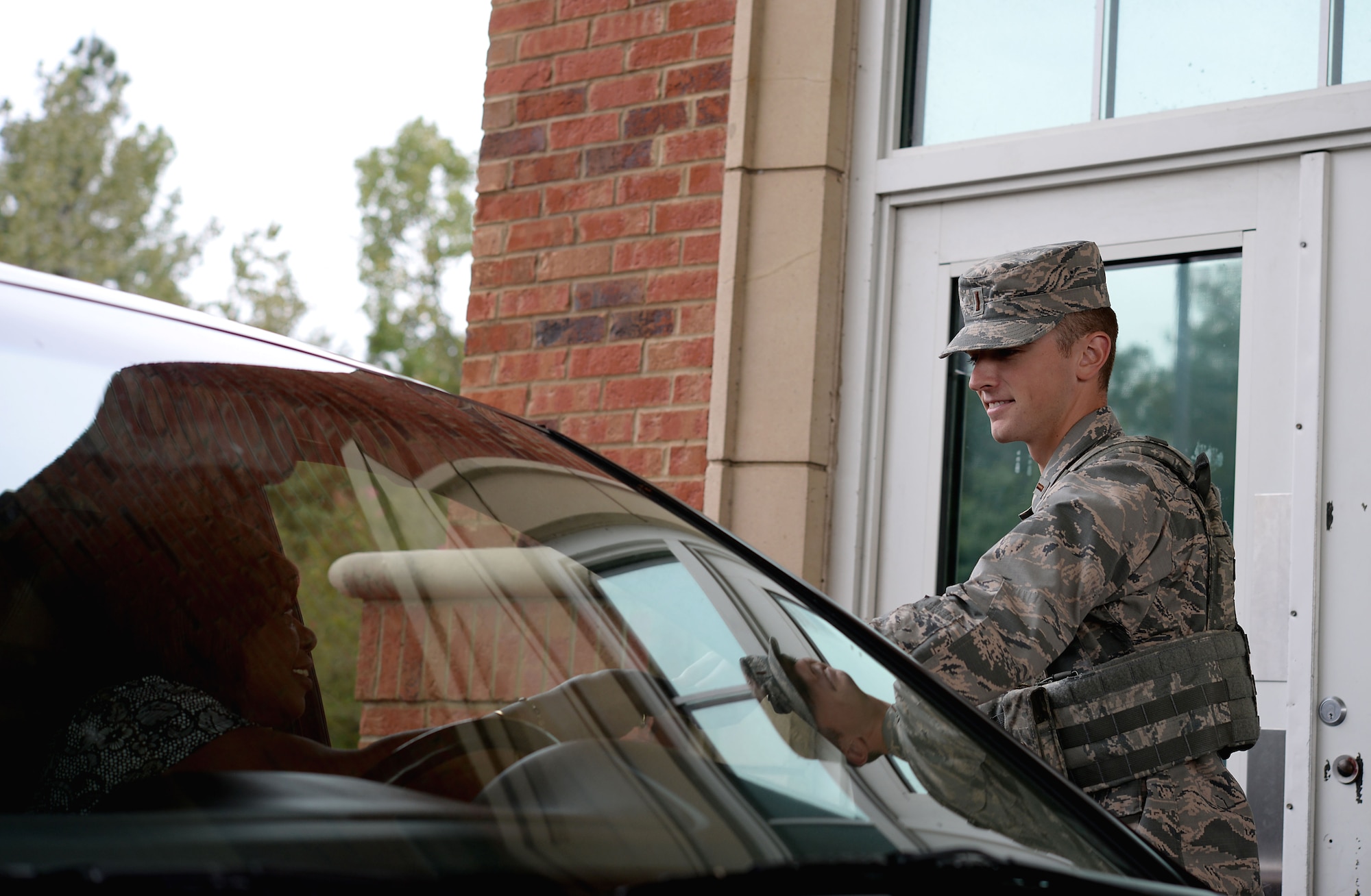 Second Lt. Jason Bentley, 14th Student Squadron student pilot who is assisting the 14th Security Forces Squadron, works the front gate Oct. 3, 2017, on Columbus Air Force Base, Mississippi. Before entering the 37th or 41st Flying Training Squadrons, student pilots will work with other units on base to help manning and learn about everyday base operations. Casual lieutenants who assist the 14th SFS receive four days of training and all certifications required to work the gate. (U.S. Air Force photo by Airman 1st Class Keith Holcomb )