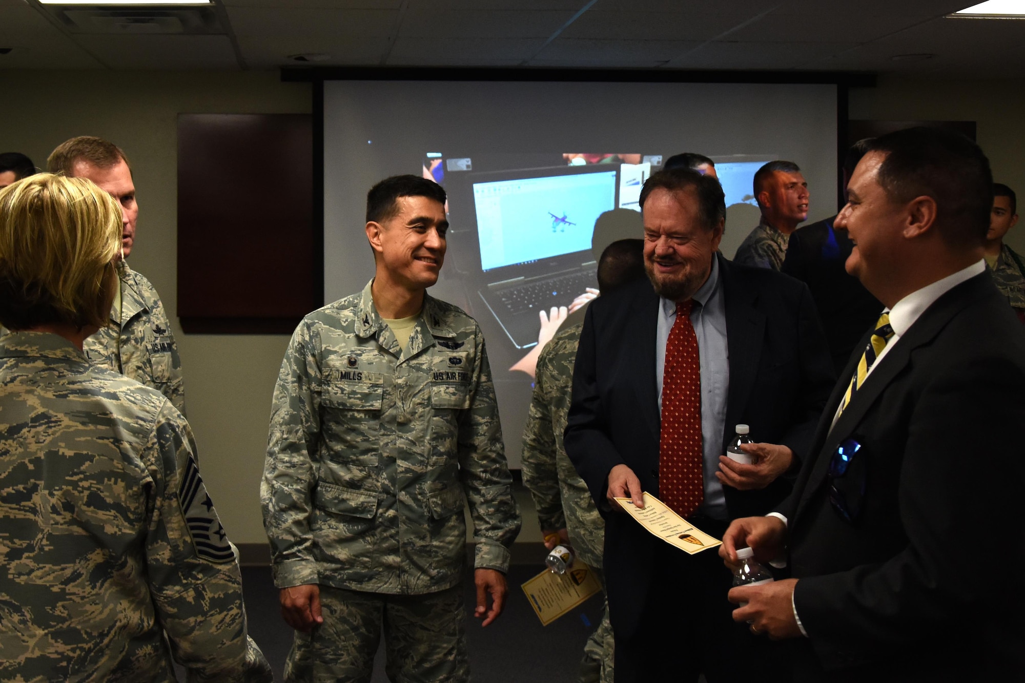 U.S. Air Force Col. Ricky Mills, 17th Training Wing commander, talks with Howard Taylor, San Angelo Museum of Fine Arts director, after the ribbon cutting ceremony for STARBASE at the STARBASE building on Goodfellow Air Force Base, Texas, Oct. 4, 2017. San Angelo Museum of Fine Arts is the tertiary funder for STARBASE. (U.S. Air Force photo by Airman Zachary Chapman/Released)