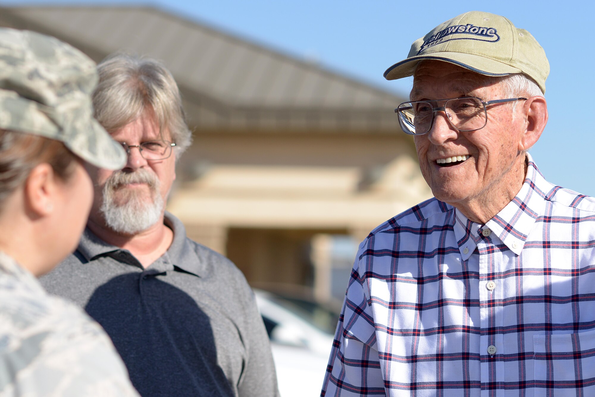 Manuel Martinez, a World War II veteran, interacts with Airmen assigned to the 56th Fighter Wing during a tour at Luke Air Force Base, Ariz., Oct. 2, 2017. Martinez spent the morning reminiscing about his time at the base decades ago and learned about how the Air Force runs today. (U.S. Air Force photo by Senior Airman Devante Williams)