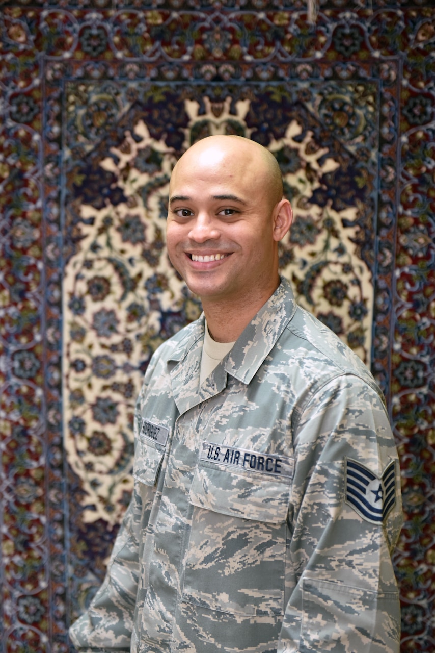 Tech. Sgt. Siddartha Sosa-Rodriguez, NCO in charge of plans and programs with the 380th Air Expeditionary Wing Chapel, poses for a photo at Al Dhafra Air Base, United Arab Emirates, Oct. 4, 2017.