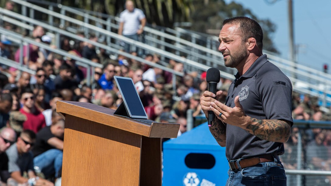 Chad Robichaux a former Force Recon Marine, Pro MMA Champion, and founder of Mighty Oaks Foundation speaks to Headquarters and Support Battalion Marines about overcoming personal struggles after leaving the Marine Corps during the Spiritual Fitness Fair at Camp Pendleton’s Paige Fieldhouse, Oc.t 5, 2017. The Spiritual Fitness Fair was organized to promote spiritual and mental wellness with the end state being a safe, well attended event that enhances the morale and esprit de corps of the battalion. (Official Marine Corps photo by Sergeant Hector de Jesus)