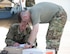 U.S. Air Force Tech. Sgts. Amy Mattia and Ronald Toia, loadmasters with the 746th Expeditionary Airlift Squadron, sign for mail and review squadron paperwork at Al Udeid Air Base, Qatar, Oct. 3, 2017.