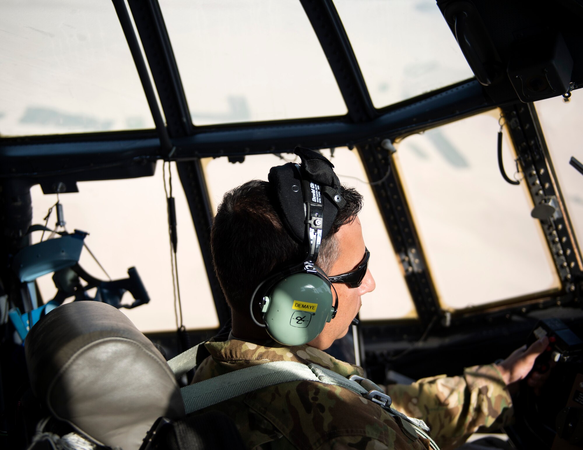 U.S. Air Force Capt. Michael DeMaye, aircraft commander with the 746th Expeditionary Airlift Squadron, turns a C-130 Hercules for final approach at Al Dhafra Air Base, United Arab Emirates, Oct. 3, 2017.