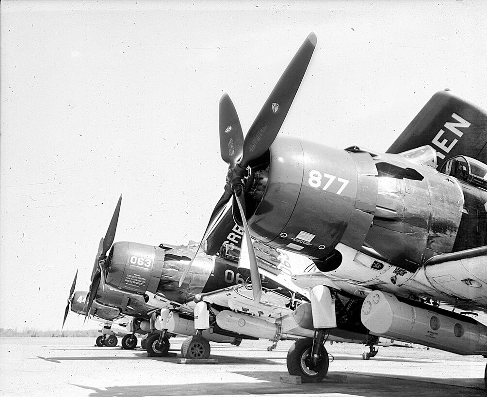 IMAGE; 03/23/1955
AVIATION HISTORY: Shot of Dahlgren Navy Planes on Ground, Visible Plane #'s 063, 877 Single Prop
planes.