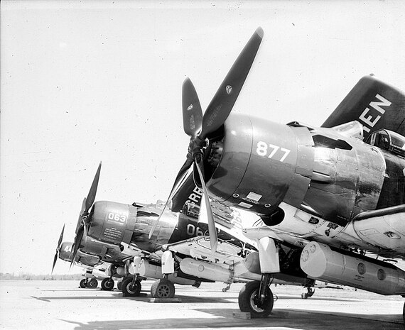 IMAGE; 03/23/1955
AVIATION HISTORY: Shot of Dahlgren Navy Planes on Ground, Visible Plane #'s 063, 877 Single Prop
planes.