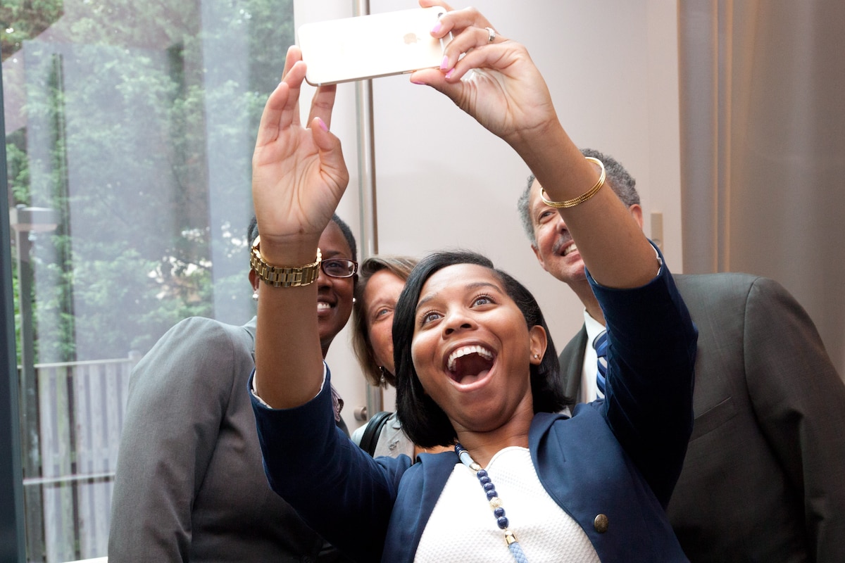 Several people pose for a selfie.