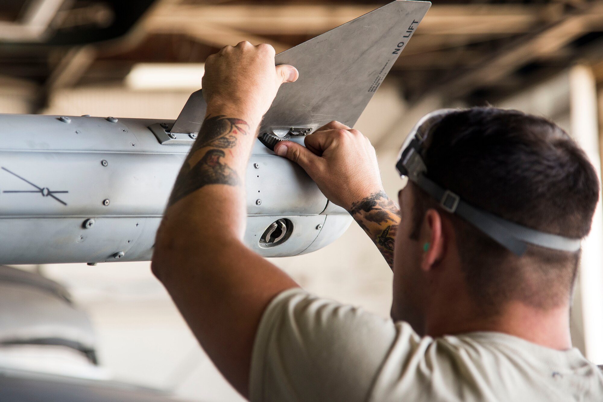 U.S. Air Force Airman 1st Class Andrew Dunkle, 20th Aircraft Maintenance Squadron load crew team member, attaches a fin to an AIM-120 advanced medium-range air-to-air missile during a quarterly load crew competition at Shaw Air Force Base, S.C., Oct. 4, 2017.
