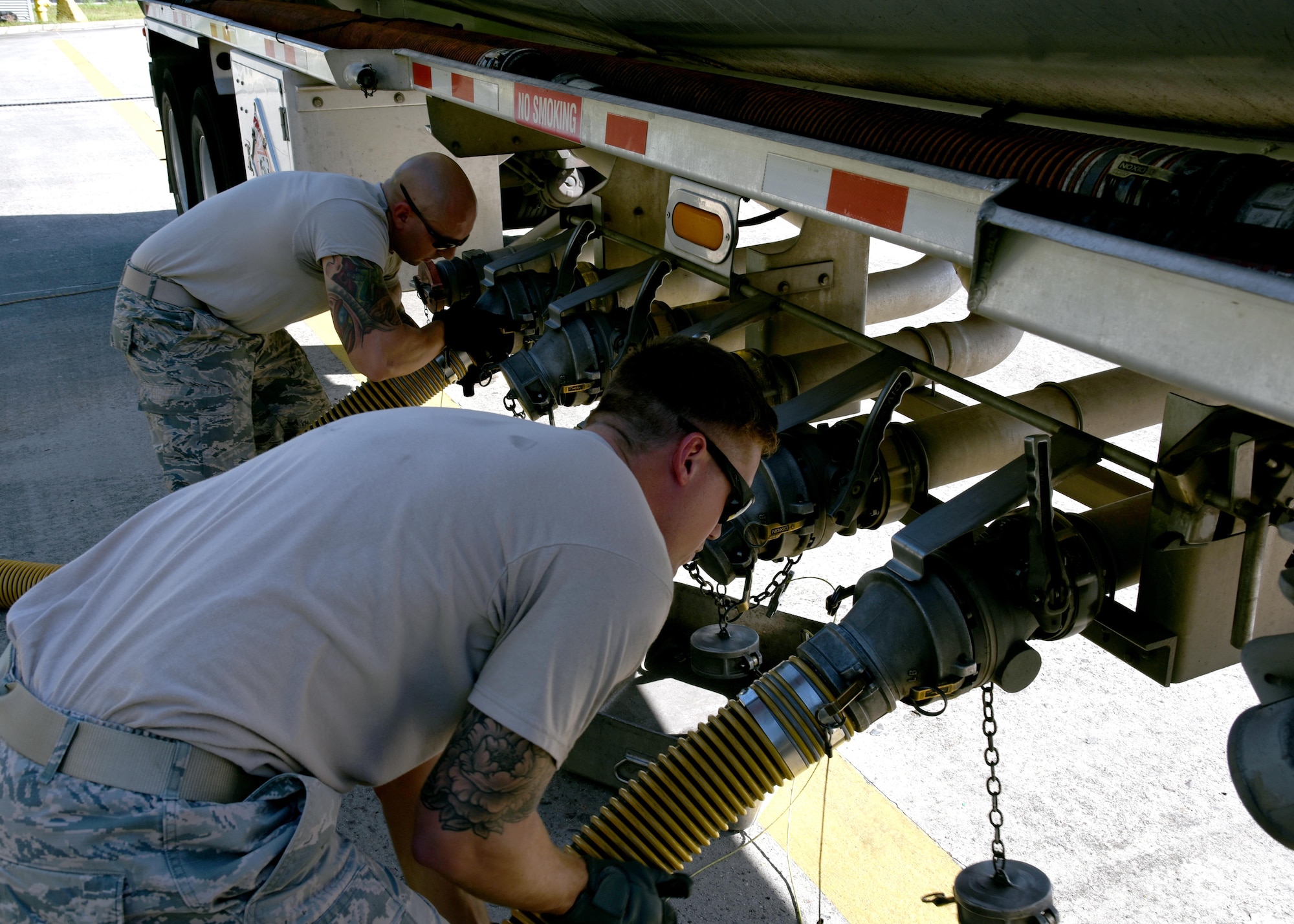 Fuels Distribution System Technicians, Staff Sgt. Justin Bradford, a volunteer from the 134th Air Refueling Wing, McGhee Tyson Air National Guard Base (left) and Staff Sgt. Jared Dabney, 165th POL, operate a truck offloading header valve to take fuel during a fuel delivery to the Savannah Air National Guard Base, Oct. 4, 2017.