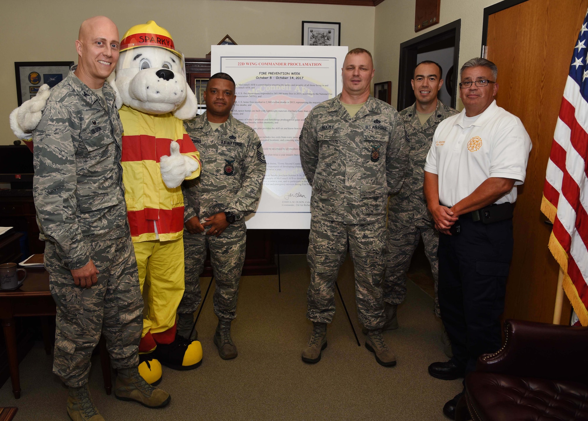 Col. Josh Olson, 22nd Air Refueling Wing commander, signs the fire prevention week proclamation Oct. 5, 2017, at McConnell Air Force Base, Kansas. This year’s theme ‘Every Second Counts: Plan 2 Ways Out!’ will help educate individuals to have more than one escape route while developing a home escape plan.