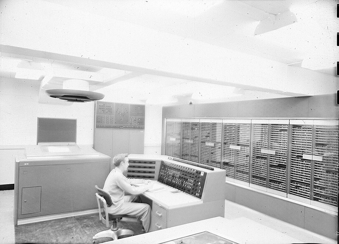IMAGE: 09/23/1955 
Computer room, interior shot, with man at console, IBM calculator, NORC