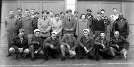 IMAGE: 12/07/1955
FILM HISTORY: Photo Lab shot taken before CHPHOT (Wolfs Leaving) In front of (Bamberg, B.I.D. &S Dept. No. 7) Front Row L-R: Fallin, B.E., Howard, G.P., Noonan, P.P., King, C.T., Fisher, D.R., Ainslie, G.H., Collier, A.S.  Second Row L-R: Jones, P.M. Eddins, G.G., Koenig, V.A. DeShazo, C.H., Wolf, L.G., Clark, A.R., Grigsby, F.R., Robinson, J.A.