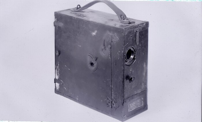 IMAGE: 01/11/1949
FILM HISTORY: 3/4 view of 35mm Universal Movie Camera No. 1884 received at Indian Head, Maryland approx. 1912 for the test of USS PENNA Triple Mounts. This camera has a maximum frame speed of approx. 16 fps and is of the intermittent motion type.