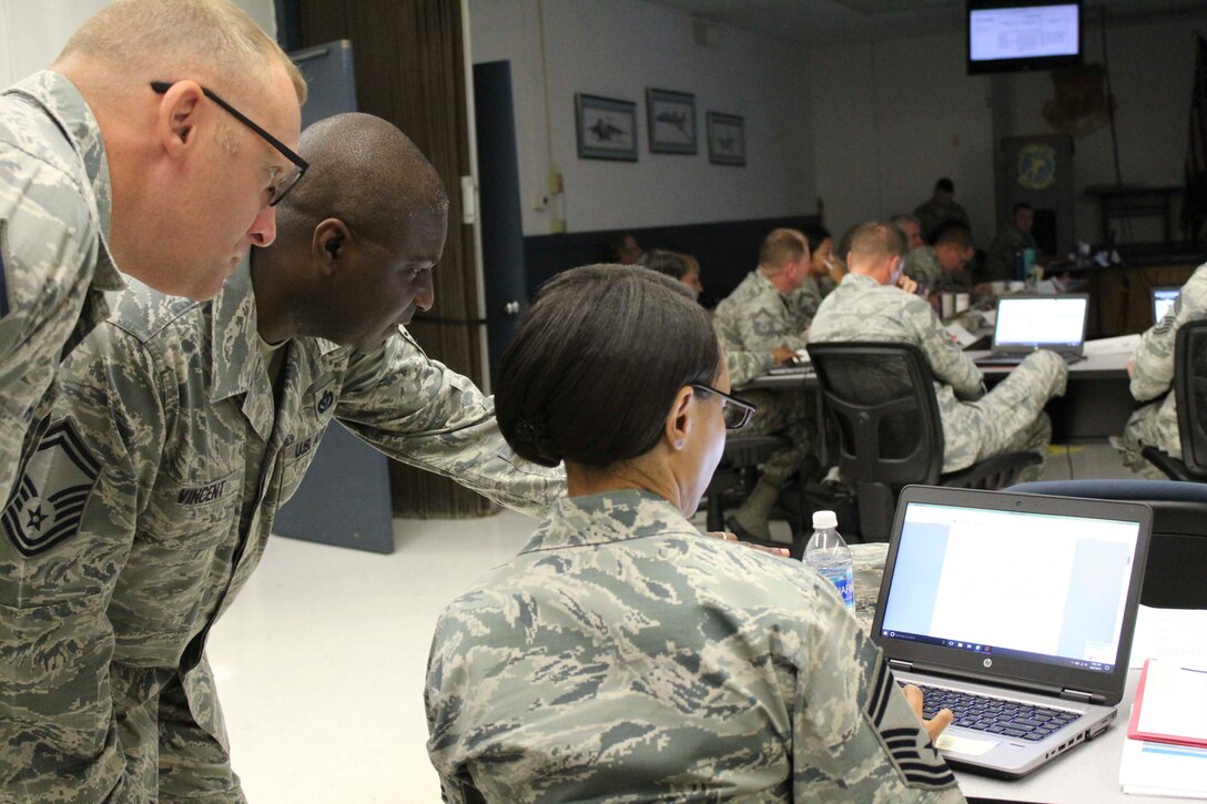 AFCEC force development team members discuss potential changes to engineer training requirements during a recent Strategic Training Requirements Team meeting at Ft. Leonard Wood, Missouri. The group collaborated with major command leaders, Air National Guard and Air Force Reserve teams to develop new training requirements. (U.S. Air Force Photo by Susan H. Lawson)