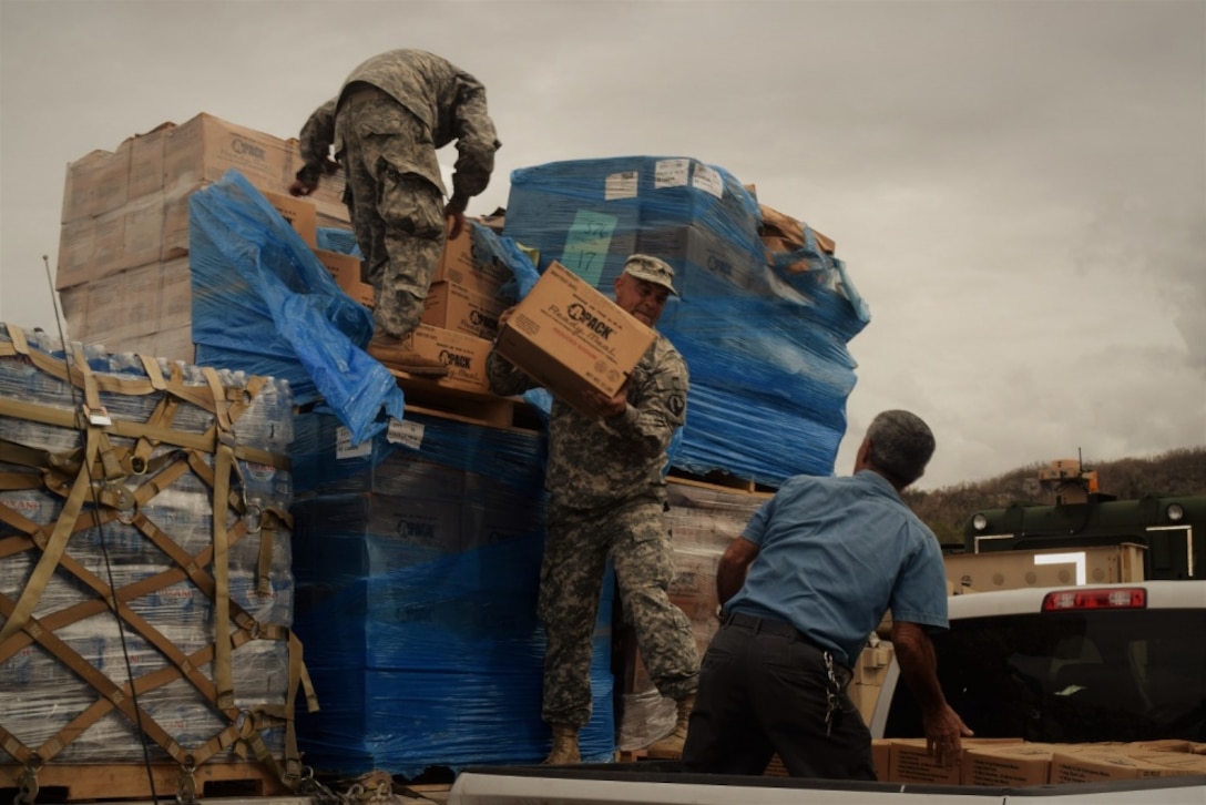 Soldiers assist the Federal Emergency Management Agency to deliver relief supplies to the residents of Puerto Rico.