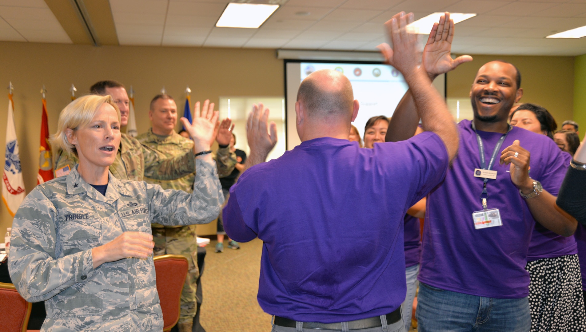 Brig. Gen. Heather Pringle, commander, 502nd Air Base Group and Joint Base San Antonio, greets delegates of one of the focus groups at the Armed Forces Action Program annual forum, held at the Installation Management Command Academy Oct. 3-6.