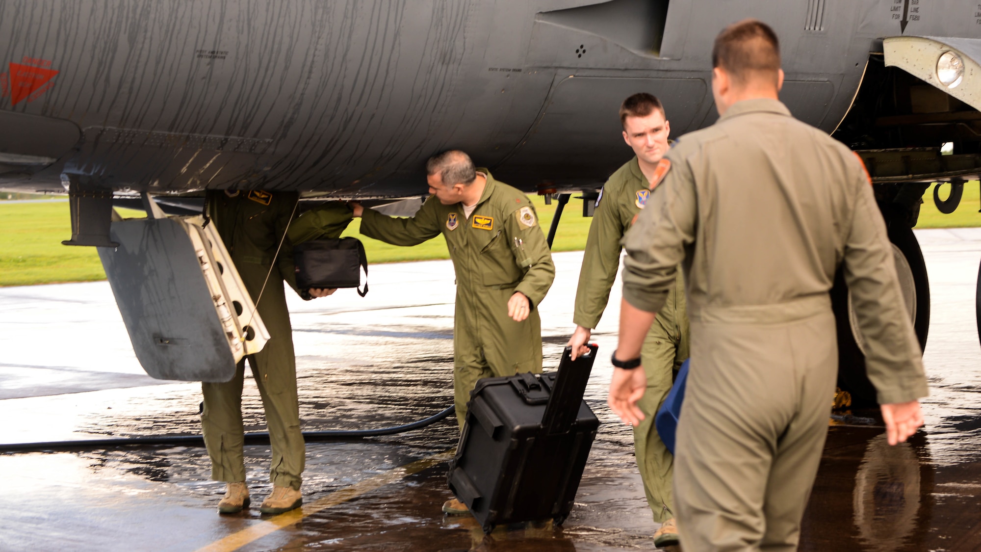 Aircrew retrieve their equipment from a B-52 Stratofortress upon arrival at Fairford Royal Air Force Base, U.K., Sept. 14, 2017.