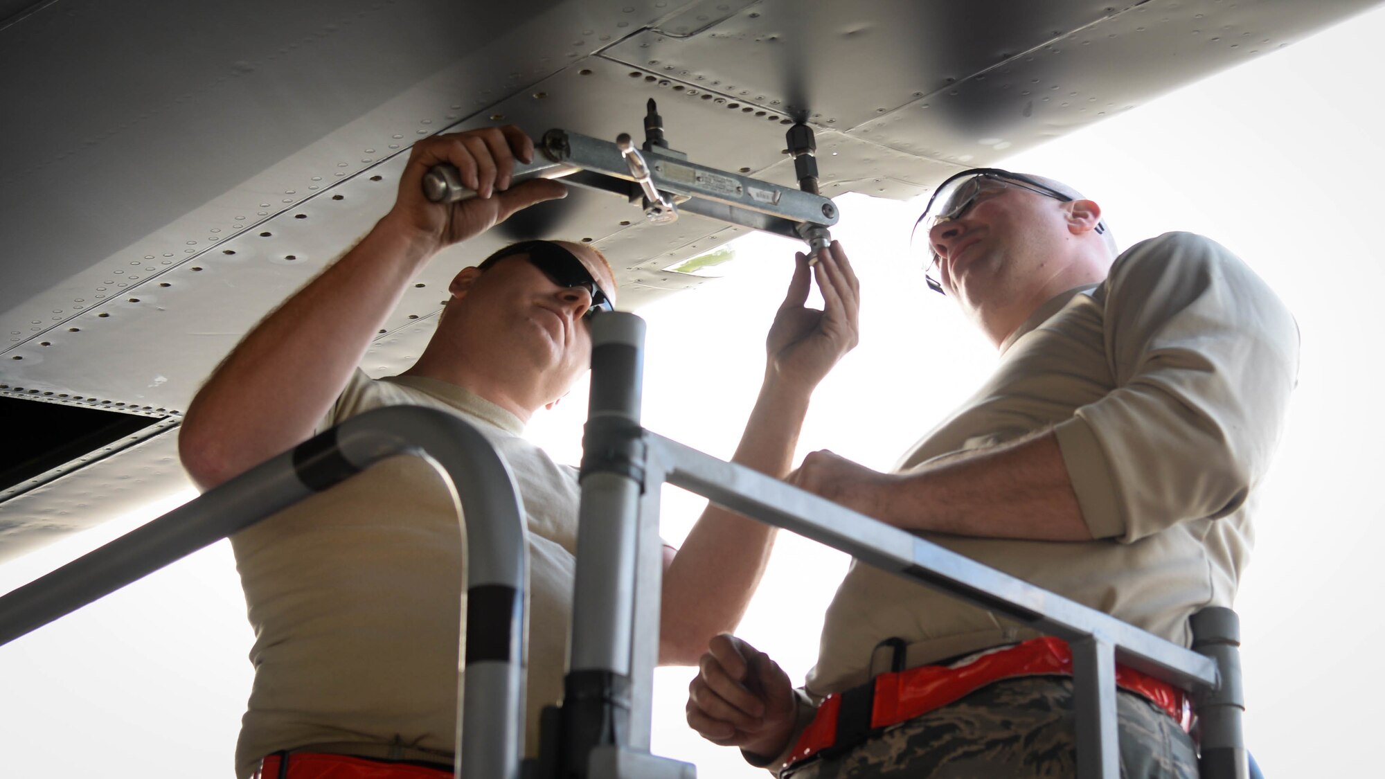 Maintainers from the 96th Aircraft Maintenance Unit remove a panel from a B-52 Stratofortress while deployed to Fairford Royal Air Force Base, U.K., Sept. 26, 2017.