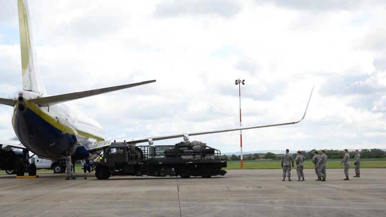 Luggage is retrieved from an aircraft at Fairford Royal Air Force Base, U.K., Sept. 11, 2017.