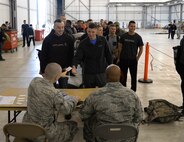 Airmen receive their room keys upon arrival to Fairford Royal Air Force Base, Sept. 11, 2017.