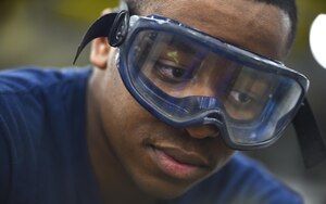 Mineman 3rd Class Willie Buckner, Navy Munitions Command Atlantic Unit Charleston, repaints a Mark 15 fin at Joint Base Charleston Weapons Station, S.C., Aug. 29, 2017. The Charleston unit is the largest intermediate maintenance activity for mines in the world. Their area of responsibility covers more than half the globe.