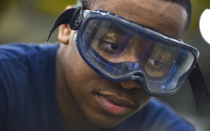 Mineman 3rd Class Willie Buckner, Navy Munitions Command Atlantic Unit Charleston, repaints a Mark 15 fin at Joint Base Charleston Weapons Station, S.C., Aug. 29, 2017. The Charleston unit is the largest intermediate maintenance activity for mines in the world. Their area of responsibility covers more than half the globe.
