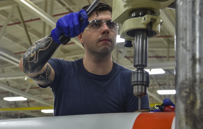 Mineman Seaman Dalton Sawyers, Navy Munitions Command Atlantic Unit Charleston, Navy Munitions Command Atlantic Unit Charleston Sailor, drills into munitions at Joint Base Charleston Weapons Station, S.C., Aug. 29, 2017.