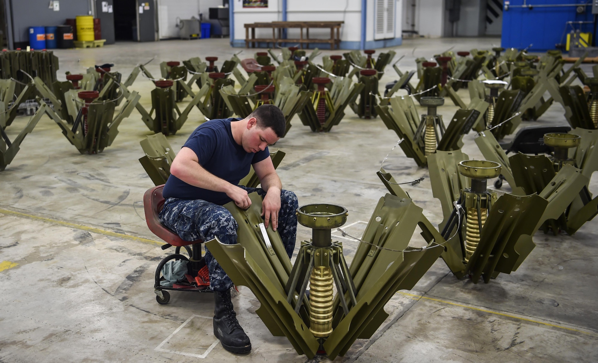 Mineman 3rd Class Petty Officer Alonso Tamez, Navy Munitions Command Atlantic Unit Charleston, buffs a Mark 15 fin at Joint Base Charleston Weapons Station, S.C., Aug. 29, 2017.