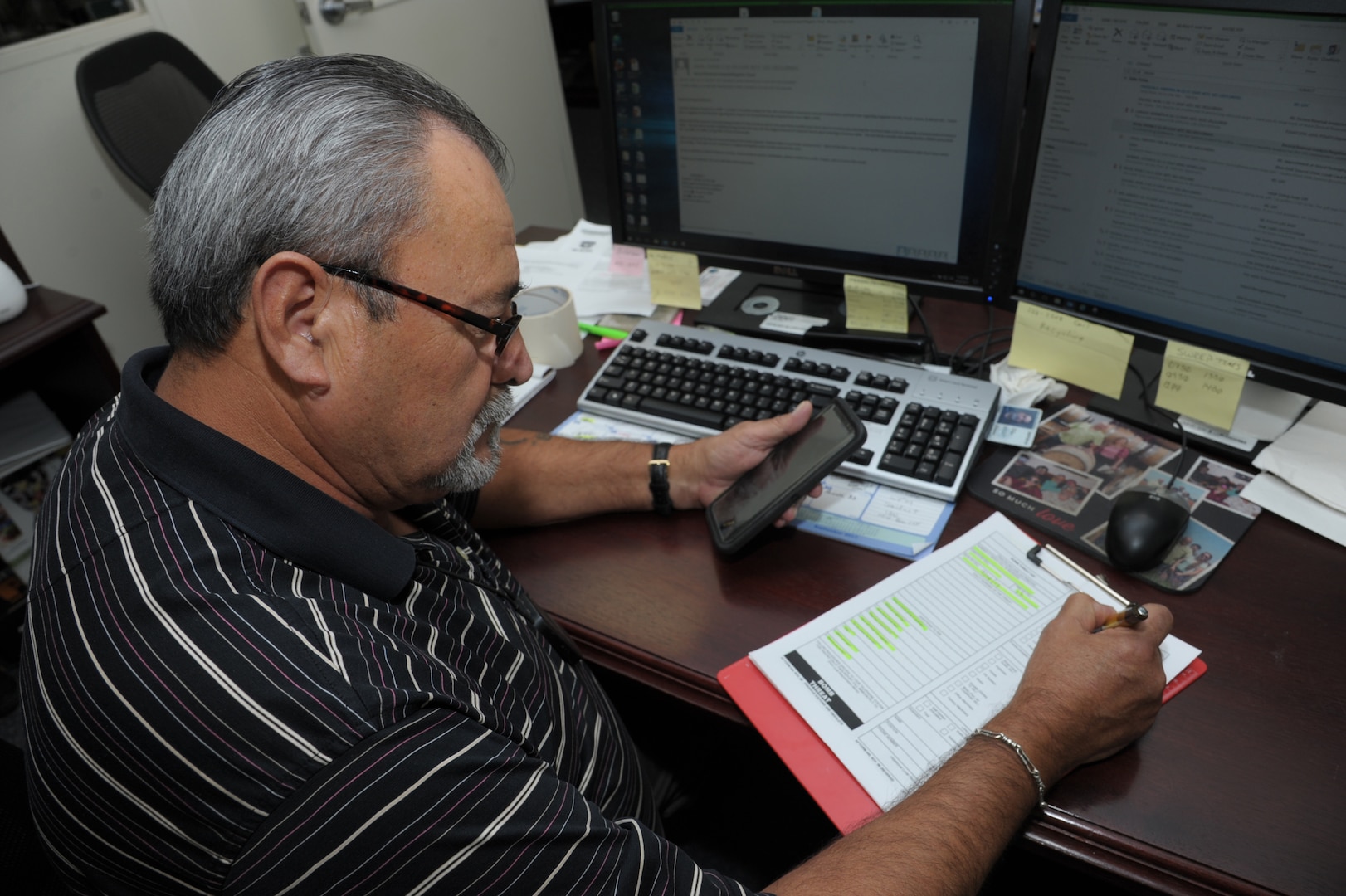 Armando Lerma, 502nd Logistics Readiness Squadron, chief of operations writes all information on the Air Force Form 440, bomb threat questioner, during a building bomb threat exercise, Sept. 28, 2017 at Joint Base San Antonio-Randolph. The primary purpose of the internal LRS exercise is to practice building evacuation and remind employees the location of their primary and alternate rally points.  ( U.S. Air Force photo by Joel Martinez)