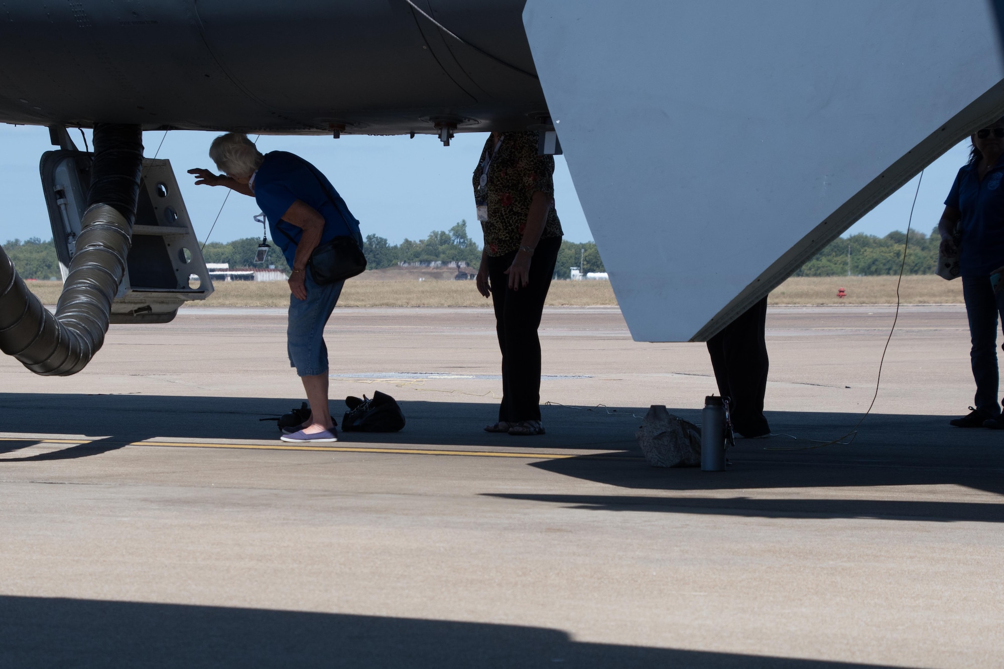 A line of Ninety-Nines wait to enter the aircrew compartment of a B-52 Stratofortress on Barksdale Air Force Base, La. Oct. 6, 2017.