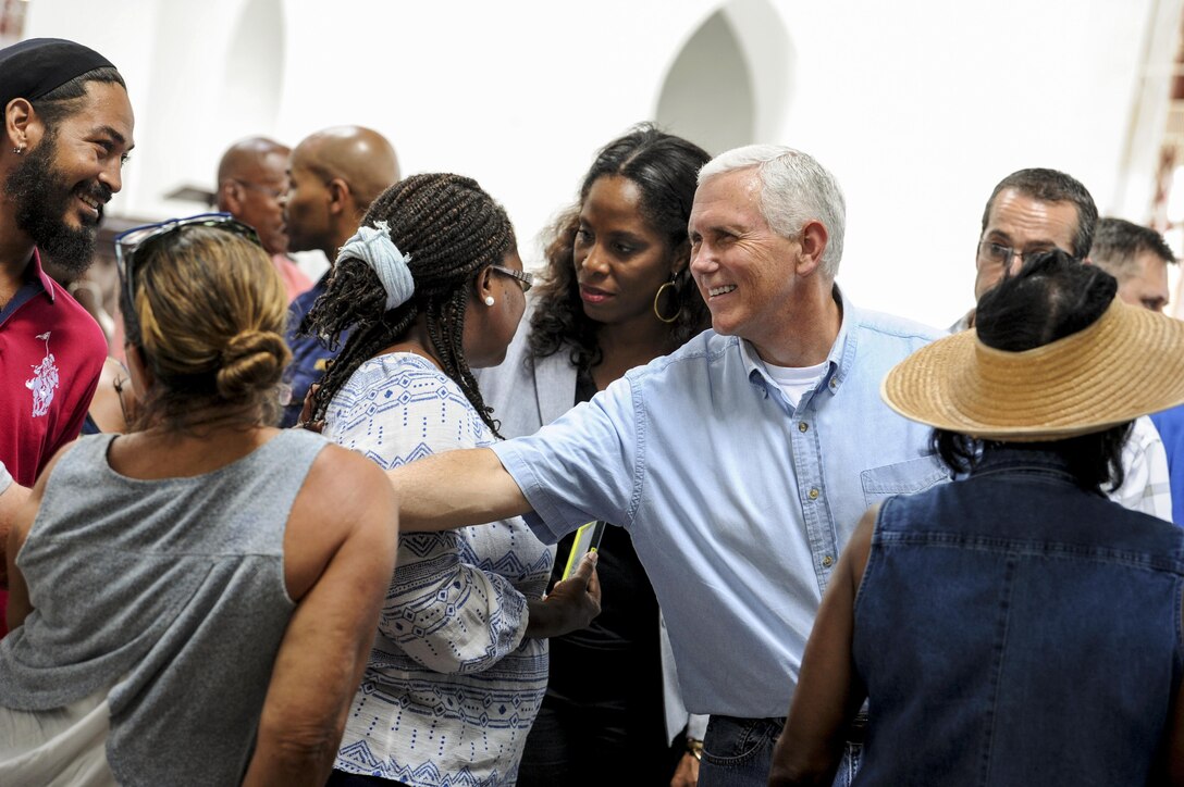 Vice President Mike Pence greets churchgoers.