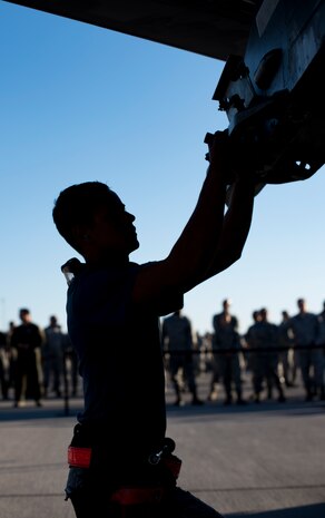 An Airman from the 57th Maintenance Group prepares a missile assembly on an F-16 Fighting Falcon, assigned to the 16th Weapons Squadron, during a load crew competition Oct. 6, 2017, at Nellis Air Force Base, Nev. Multiple squadrons participated in the competition which tested their speed and accuracy when loading munitions onto an aircraft. (U.S. photo by Airman 1st Class Andrew D. Sarver/Released)