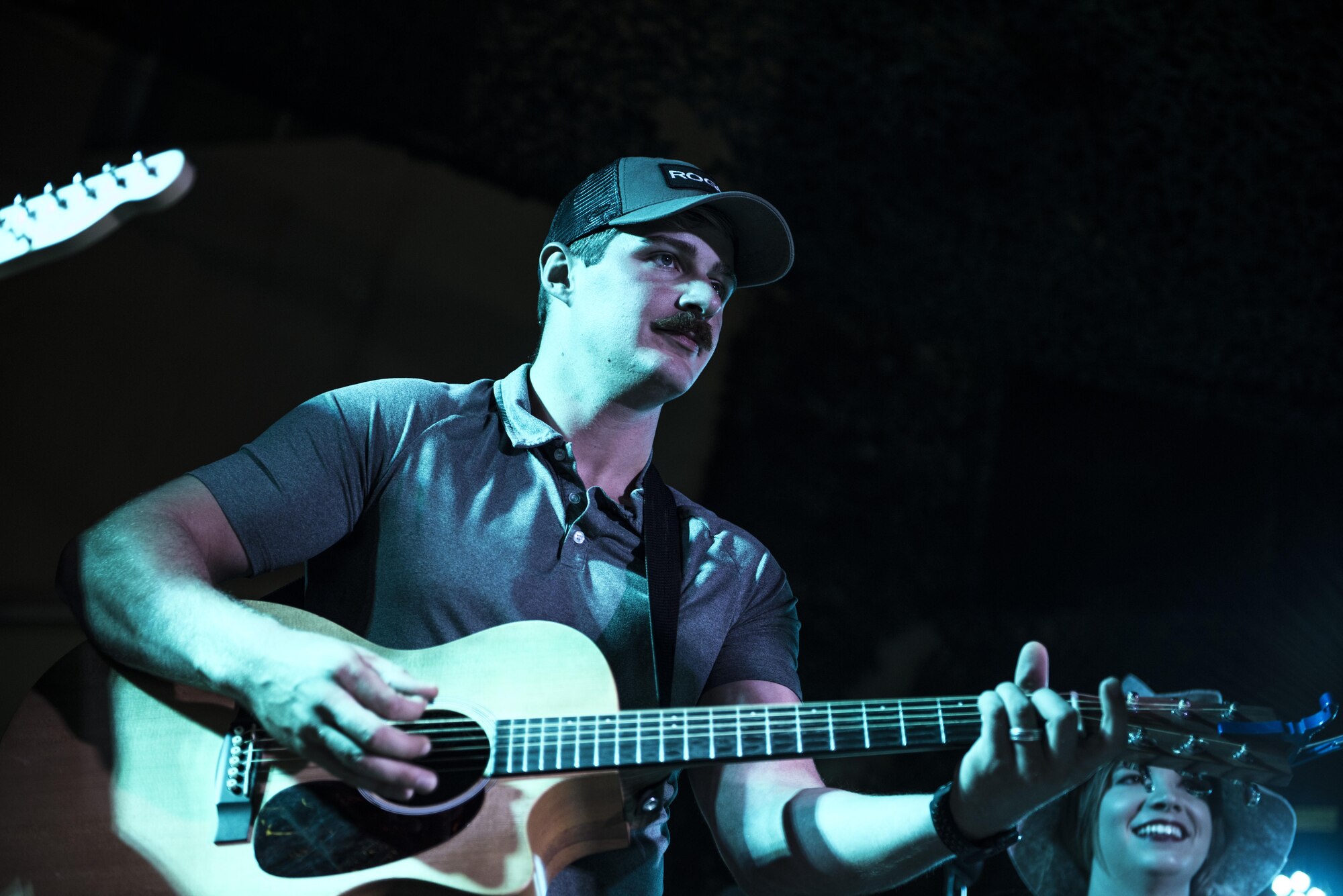 U.S. Air Force Capt. Cory Howe, assigned to the 332nd Air Expeditionary Wing, performs alongside other Coalition service members during an Oktoberfest celebration Sept. 24, 2017, in Southwest Asia. The group teamed up on a number of modern and classic hits from across the U.S. and Europe. (U.S. Air Force photo by Senior Airman Joshua Kleinholz)