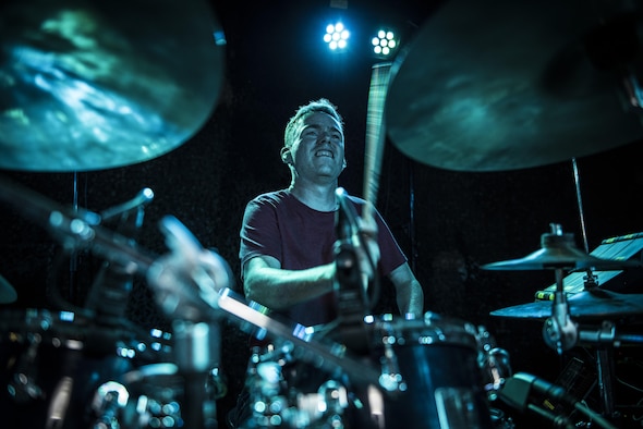 SSgt Mark Wheeler, U.S. Air Force Central Command band percussionist, powers through a drum solo during a performance at an Oktoberfest celebration Sept. 24, 2017, in Southwest Asia. The USAFCENT band is composed of musicians who tour and perform throughout the region to encourage troop morale, diplomacy, and outreach to host nation communities. (U.S. Air Force photo by Senior Airman Joshua Kleinholz)
