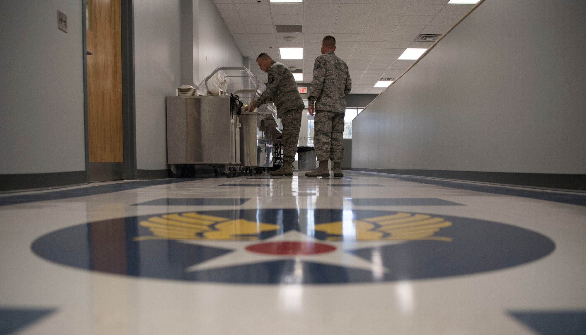 U.S. Air Force Airmen from the 130th Airlift Wing pick up lunch in the newly remodeled dining facility Oct. 7, 2017 at McLaughlin Air National Guard Base, Charleston, W.Va. New booth seating, furniture, custom tile floors, and new paint are some of the updates patrons enjoyed visiting the facility. The goal in the remodel was to provide Airmen a sense of the rich history of the 130th AW. (U.S. Air National Guard photo by Tech. Sgt. Eugene Crist)