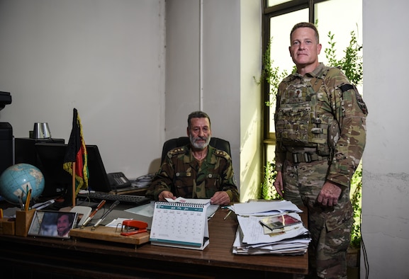 Chaplain (Maj.) Chris Conklin, Train, Advise, Assist Command-Air air advisor, (right) stands next to Afghan National Army Col. Abdul Basir, the head of the Afghan Air Force Religious and Cultural Affairs office, Sept.14, 2017, in Kabul, Afghanistan. Conklin provides training, assistance and advice on the organization of religious support in the developing AAF as the first air advisor chaplain in TAAC-Air. (U.S. Air Force photo by Staff Sgt. Alexander W. Riedel)