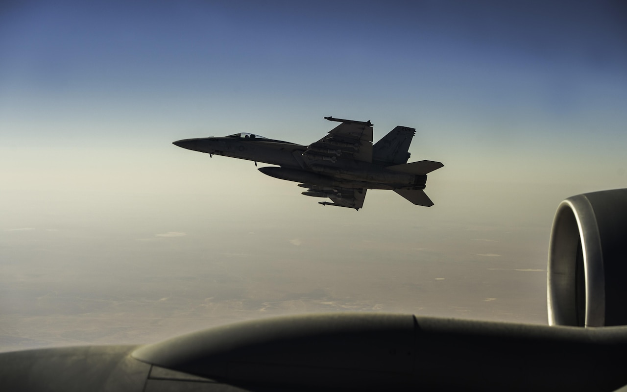 Fighter jet gets fuel in flight.