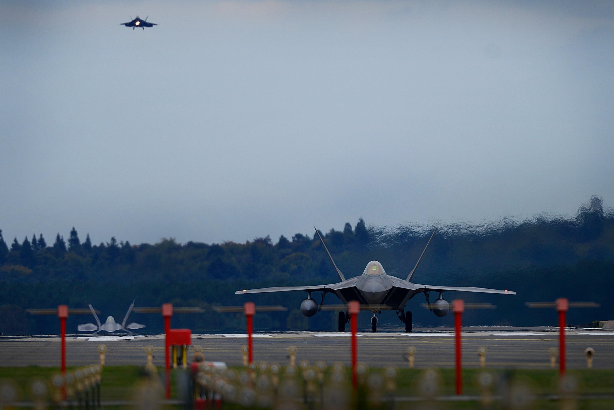 F-22 Raptors from the 1st Fighter Wing, Joint Base Langley-Eustis, Virginia arrive at Royal Air Force Lakenheath, England Oct. 8, 2017. This flying training deployment is an opportunity for the F-22s to fly alongside Europe-based U.S. and allied air force aircraft in a realistic training environment. (U.S. Air Force photo/Tech. Sgt. Matthew Plew)