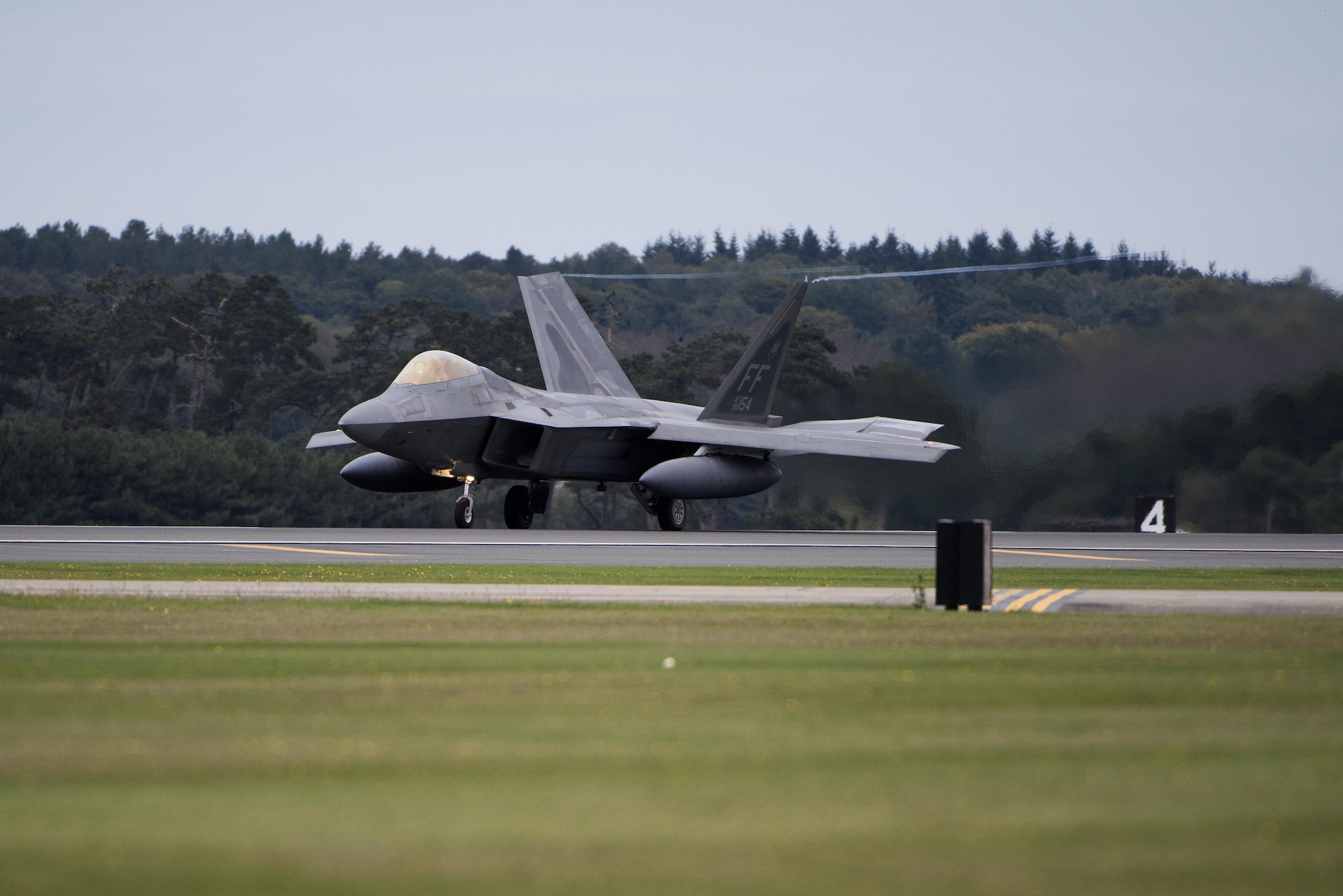 An F-22 Raptor from the 1st Fighter Wing, Joint Base Langley-Eustis,
Virginia lands at Royal Air Force Lakenheath, England Oct. 8, 2017. The U.S.
Air Force has deployed F-22 Raptors, Airmen and associated equipment to RAF
Lakenheath, for a flying training deployment to conduct air training with
other Europe-based U.S. aircraft and NATO allies. (U.S. Air Force photo/Senior Airman Malcolm Mayfield)