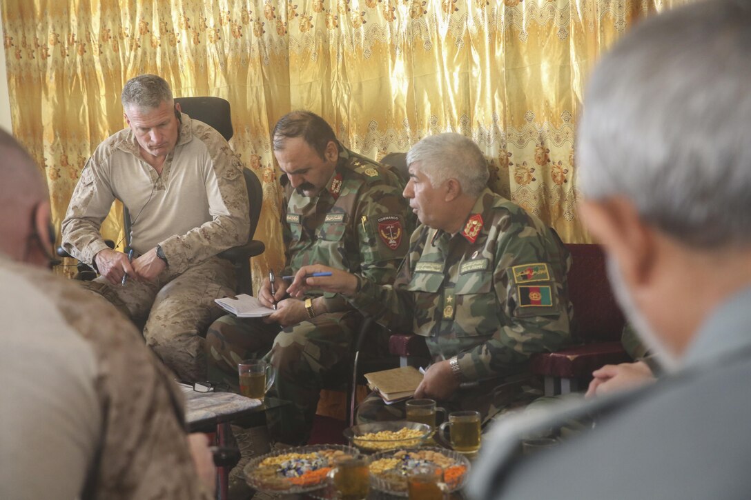 Afghan National Army Brig. Gen. Mohammed Ghani, right, the executive officer of 215th Corps, speaks with key Afghan National Defense and Security Force leaders and U.S. Marines with Task Force Southwest near Gereshk, Afghanistan, Oct. 1, 2017. Advisors with the Task Force assisted ANDSF throughout Operation Maiwand Six, which focused on clearing insurgents from Gereshk and surrounding areas. Units from the ANA, Afghan National Police and National Directorate of Security worked in unison to improve security and stability for the local populace throughout the two-week mission. (U.S. Marine Corps photo by Sgt. Lucas Hopkins)